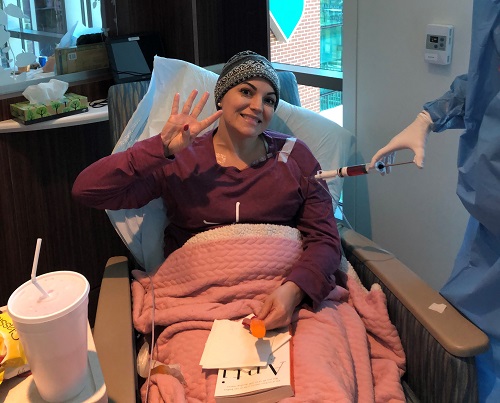 Tracy during her fourth week of chemo, holding up four fingers. 