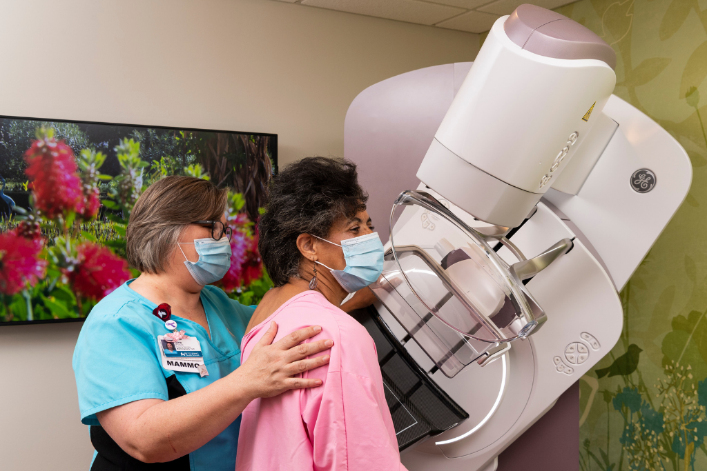 Vernese Butler receives mammogram as tech helps her