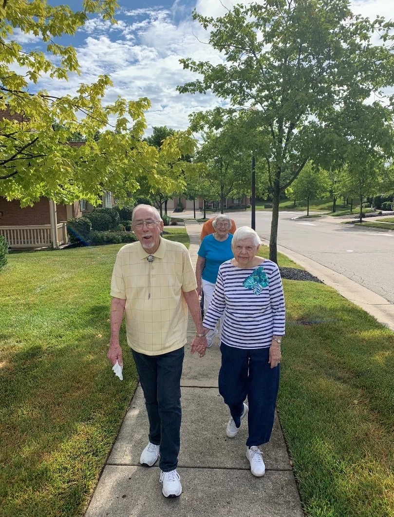 elderly women and man walking