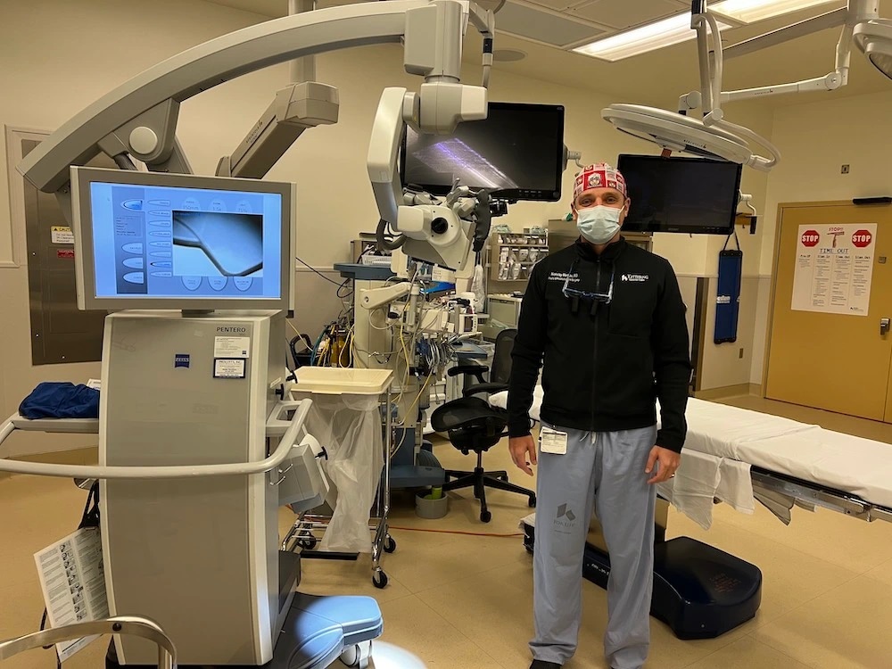 Dr. Markov looks into camera in operating room